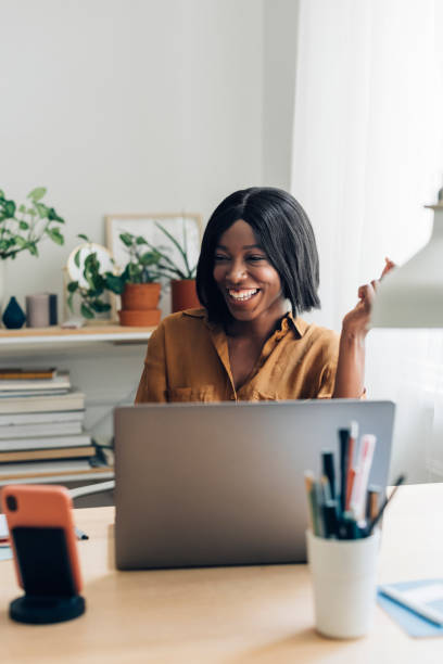 istock Happy Business Woman Working from Home on Laptop Computer 1336556416
