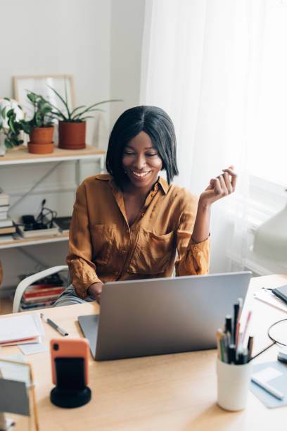 istock Happy Business Woman Working from Home on Laptop Computer 1336556418