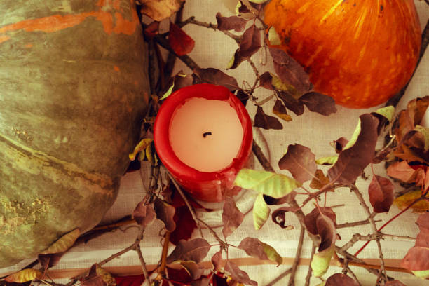 istock Stylish thanksgiving autumn table decor with pumpkin and dried branches 1336560263