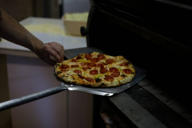 istock Fresh pizza with ingredients stock photo 1336561820