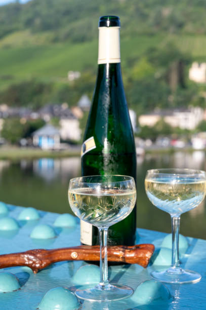 istock White quality riesling wine served on old bridge across Mosel river with view on old German town in sunny day 1336565889
