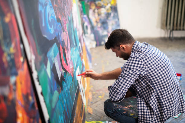 istock Artist Painting in art studio 1336569307