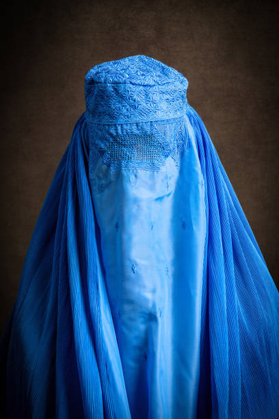 istock woman wearing a burka looking at the camera 1336572128
