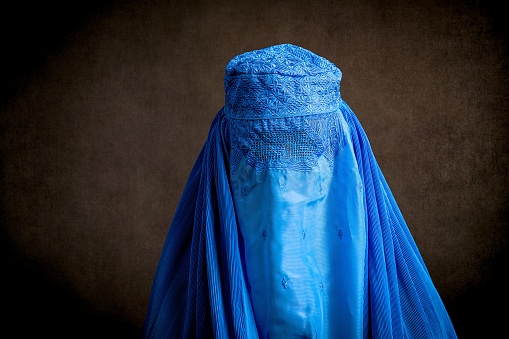 Muslim woman wearing a burka looking at the camera