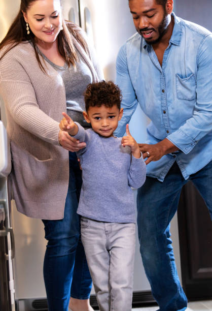 istock Multi-ethnic family, doting on boy who wants something 1336579690