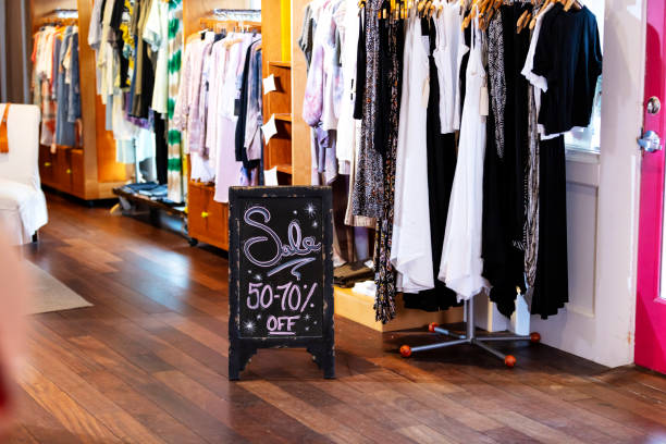 istock Sales sign in clothing store 1336580718