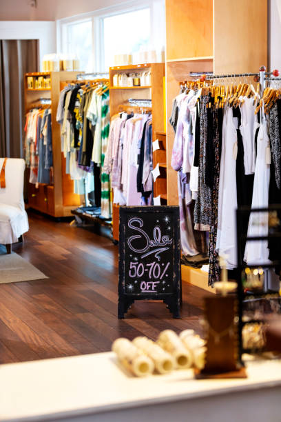 istock Sales sign in clothing store 1336580719