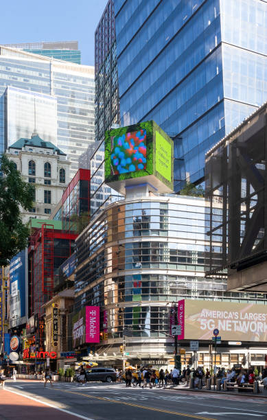 Vertical view of Eleven Times Square, an office and retail tower located at the intersection with 8th Ave and West 42nd Street, in the Times Square neighborhood. New York, NY - USA - July 30, 2021: Vertical view of Eleven Times Square, an office and retail tower located at the intersection with 8th Ave and West 42nd Street, in the Times Square neighborhood. logan west stock pictures, royalty-free photos & images