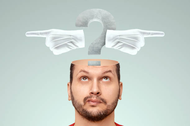 istock In the man's head there is a question mark and index fingers in different directions. The concept of the problem of choice, a difficult decision, to be or not to be, the choice of the path. 1336592975