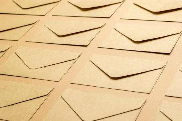 istock Background of paper postal envelopes on a paper background. 1336593025