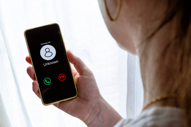 istock Woman getting call from stranger. Unknown incoming call concept 1336594462