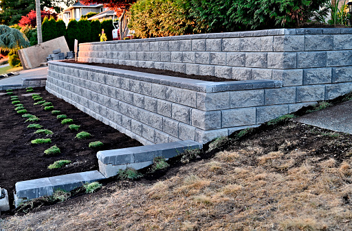 A two tier retaining block wall incorporated into an existing garden landscape designed to suit to home owners needs.