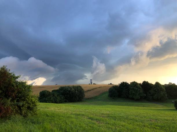 istock Dark and dramatic clouds over a lovely landscape 1336596318