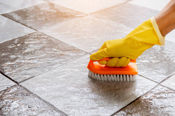 istock Using a plastic floor scrubber to scrub the tile floor with a floor cleaner. 1336601372