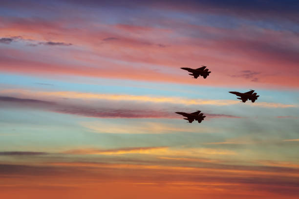 Silhouette airplane with beautiful colorful sunset sky background.