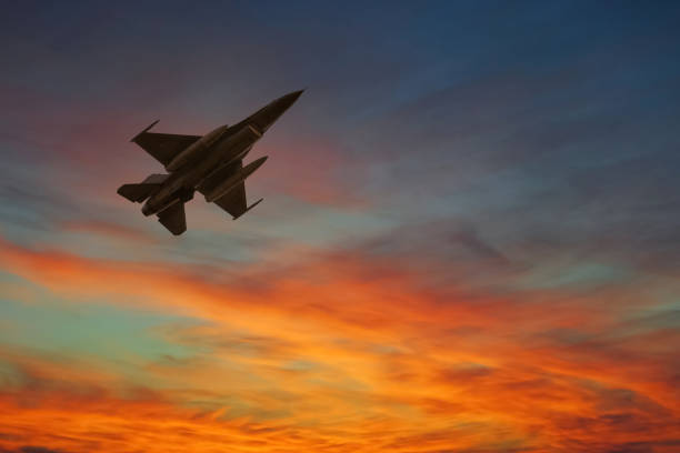 istock Silhouette airplane with beautiful colorful sunset sky background. 1336602210
