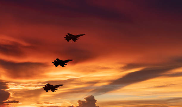 istock Silhouette airplane with beautiful colorful sunset sky background. 1336603068