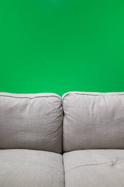 istock a gray couch stands in front of a green screen. 1336606859
