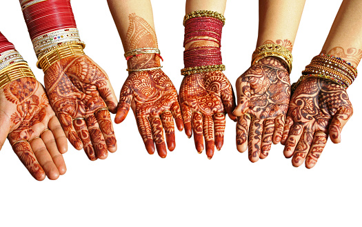 Henna or mehendi decorated hands of three  ladies, isolated over over white . Apt for Diwali, Deepawali, Durga pooja, Rakshabandhan, Raakhi, Ganesh Chaturthi, Karwa chauth, Karva chauth, Karwachauth, Karvachauth Teej festivals.