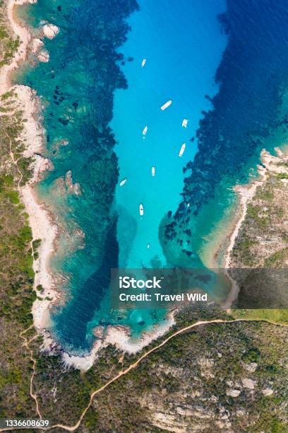 View From Above Stunning Aerial View Of A Green And Rocky Coastline Bathed By A Turquoise Crystal Clear Water Costa Smeralda Sardinia Italy Stock Photo - Download Image Now