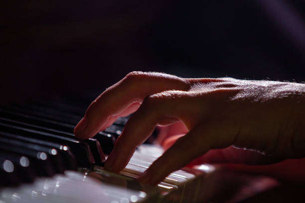 istock Pianist's fingers on a keyboard 1336608973