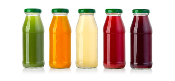 istock juice in glass bottle isolated on white 1336610106