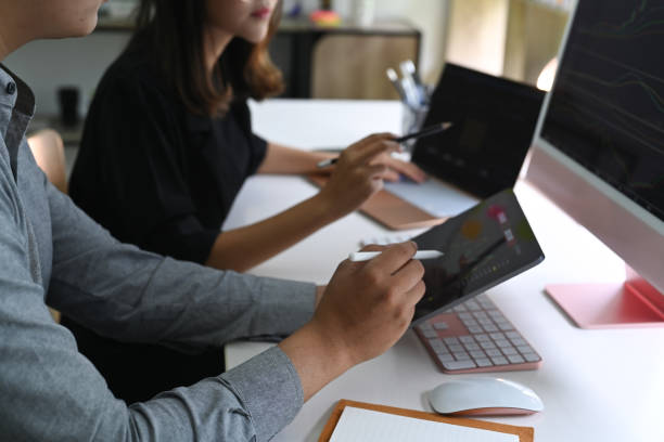 istock Business colleagues working together in modern office. 1336611946