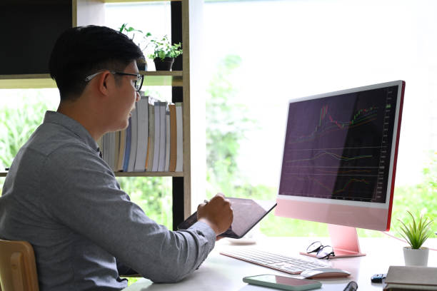 istock Businessman checking stock market data on computer at office. 1336612101