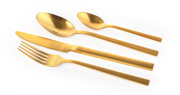 istock Golden cutlery set with fork, knife and spoon 1336613139