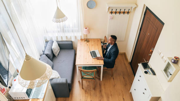 istock Young man working in his home office 1336616281