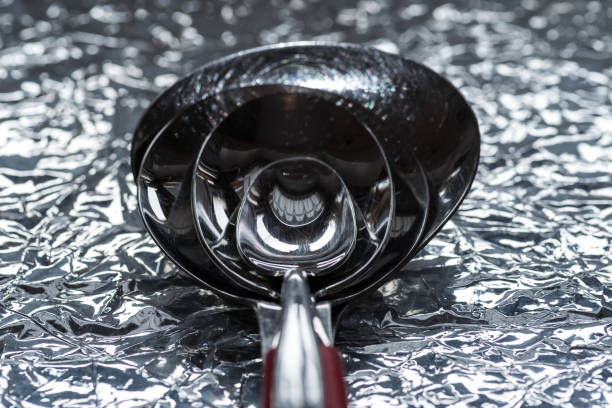4 nested spoons on an aluminum foil