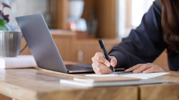 istock A woman using laptop computer for working or studying online at home 1336618599