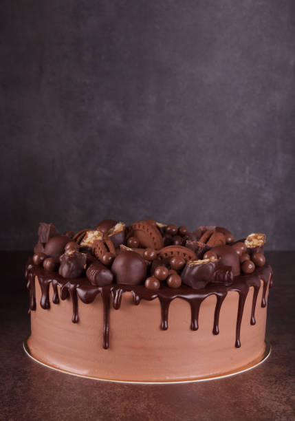 istock Delicious layered chocolate cake with decorations on dark 1336618611
