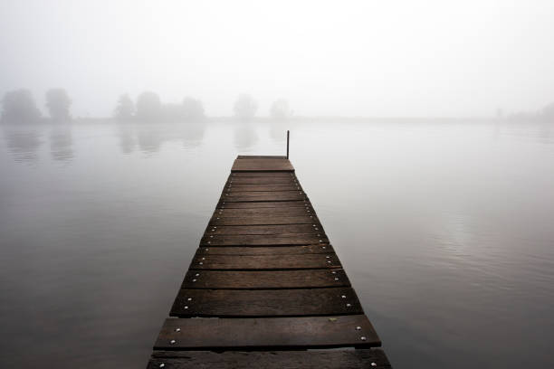 istock Jetty in the misty river Meuse 1336618614
