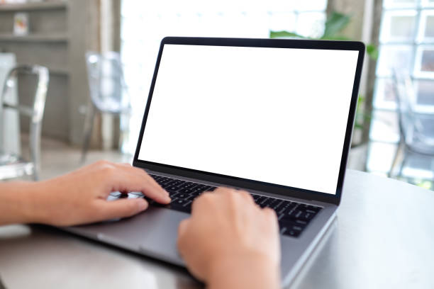 istock Mockup image of a woman using and typing on laptop computer with blank white desktop screen 1336618829