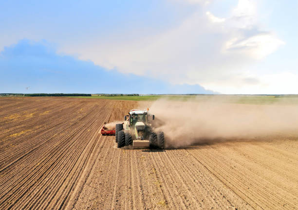 istock Agricultural tractor on cultivating field for sowing seeds. 1336620199