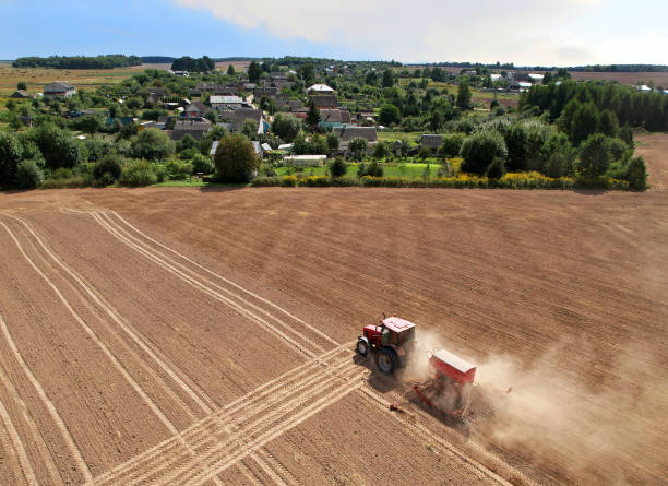 istock Agricultural tractor on cultivating field for sowing seeds. 1336620237