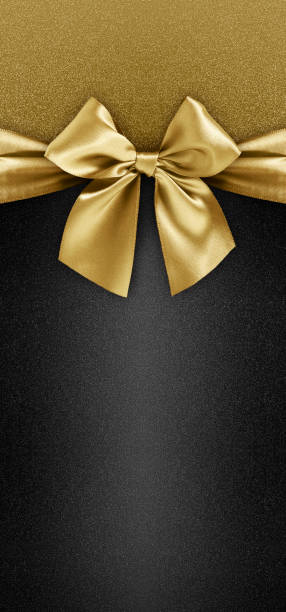 istock gift card with golden ribbon bow isolated on black background template with copy space for Merry Christmas or black friday promotional offer 1336622449