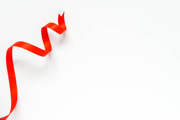 istock ribbon paper on blank white paper background 1336623308