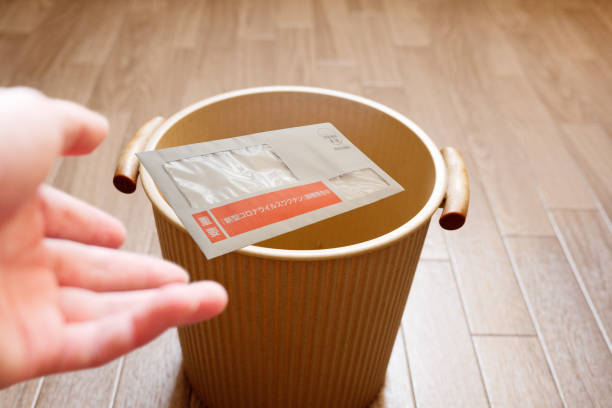 istock Throw the vaccination ticket into the trash 1336624051