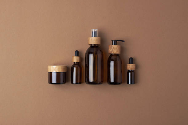 istock Skin care products on brown background. Flat lay, composition. 1336624123