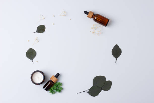 istock Skin care products on white background with eucalyptus, moss. Flat lay, copy space. 1336624140