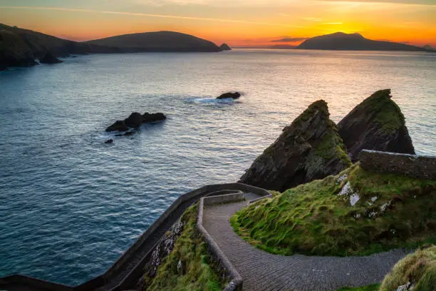 Amazing sunset over the Atlantic Ocean in the Dunquin Pier on Dingle Peninsula, County Kerry, Ireland.