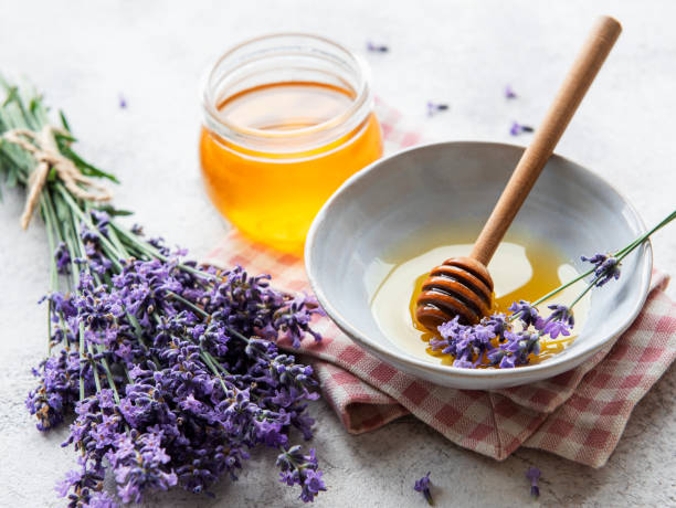 istock Jar with honey and fresh lavender flowers 1336624425