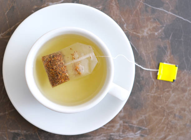 istock Herbal tea in white cup on marble 1336626370