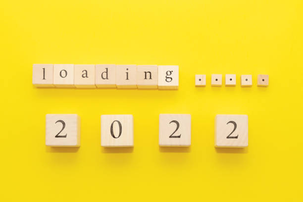 istock Waiting for 2022, a composition of cubes on a yellow background 1336627524