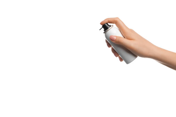 istock Aerosol in a female hand on a white background 1336627545