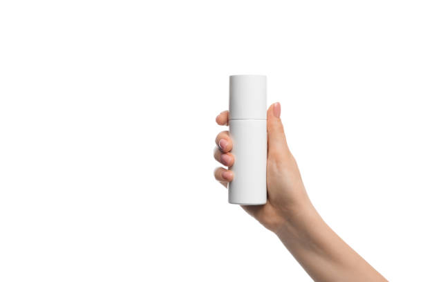 istock Aerosol container in a female hand on a white background 1336627574