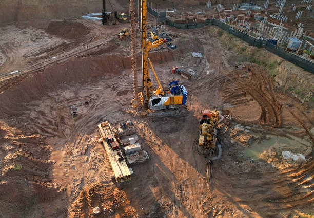 istock Deep foundation machine. Drilling rig and Pile driver at construction site. 1336628311