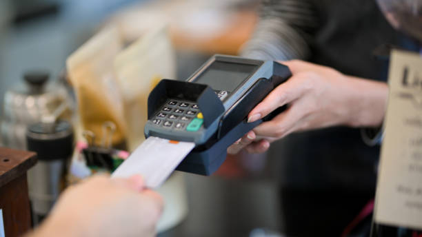 istock Closeup image of customer insert credit card in payment machine 1336629059